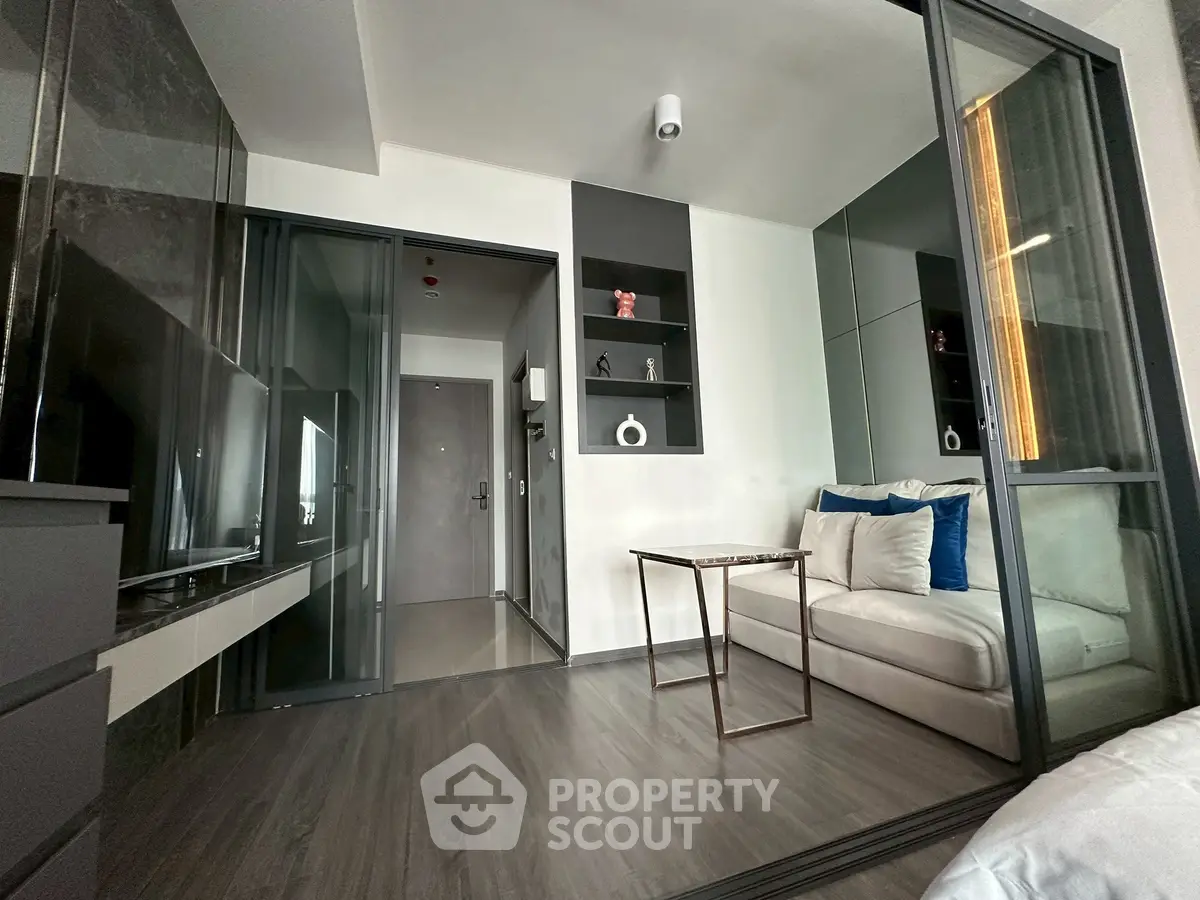 Modern living room with sleek design and glass partitions