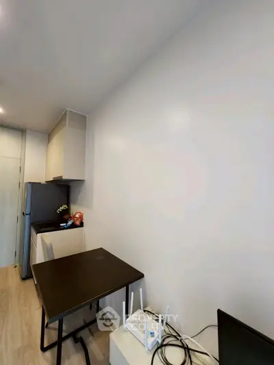 Modern compact kitchen with sleek design and essential appliances