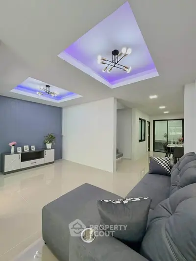 Modern living room with stylish lighting and sleek furniture, perfect for contemporary living.