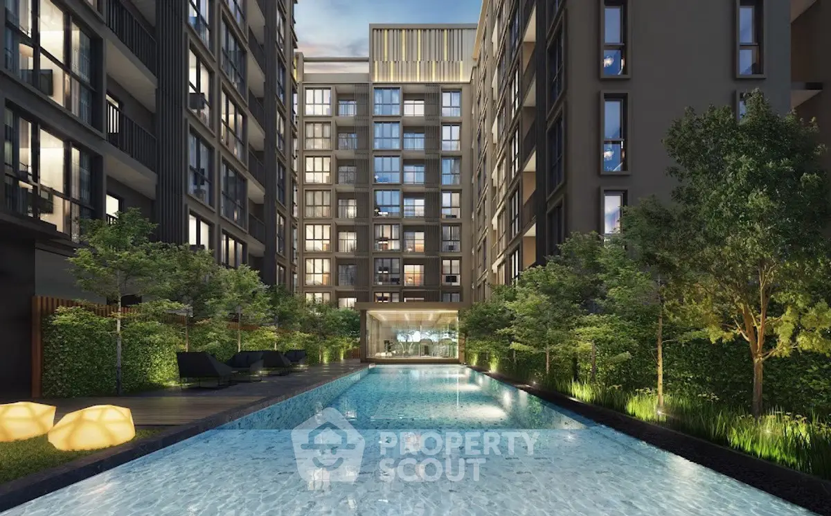 Luxurious apartment complex with stunning pool and lush greenery