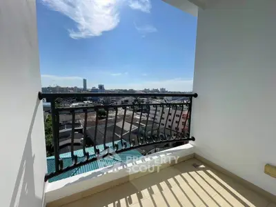 Spacious balcony with stunning city view, perfect for relaxation and enjoying the skyline.