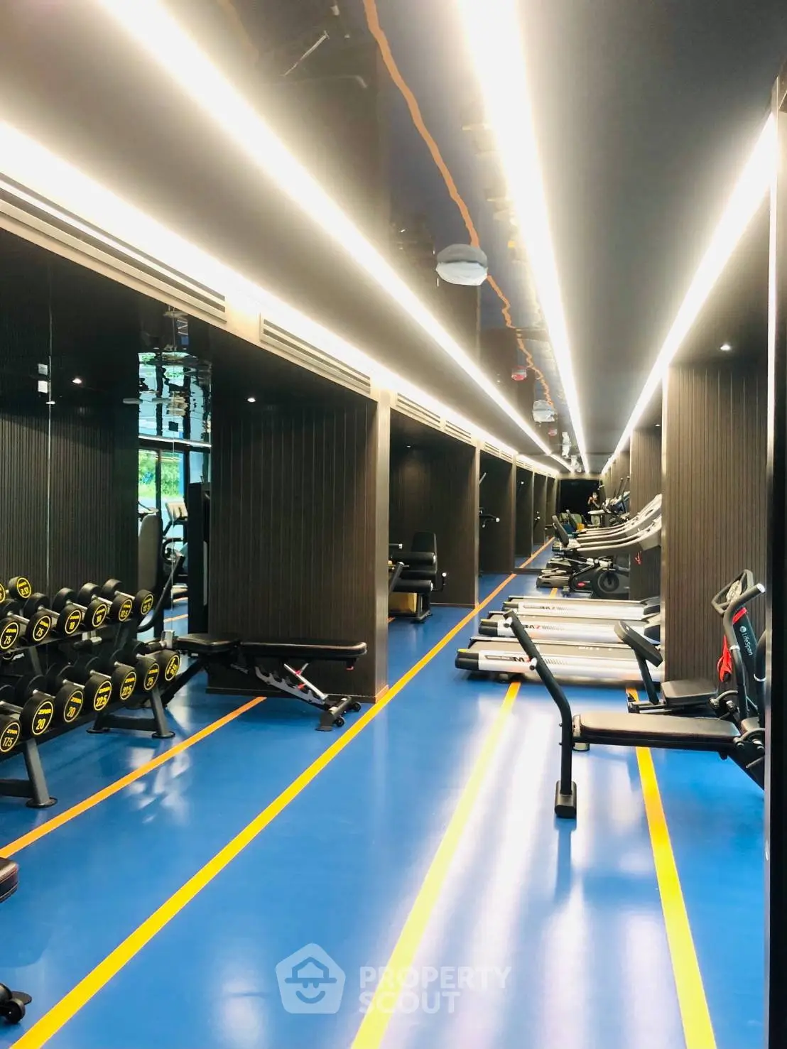 Modern gym with state-of-the-art equipment and sleek design, perfect for fitness enthusiasts.