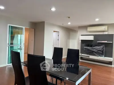 Spacious modern living room with sleek dining area and stylish furniture