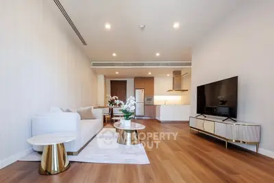 Spacious modern living room with elegant decor and open kitchen layout