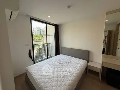 Modern bedroom with balcony view in urban apartment