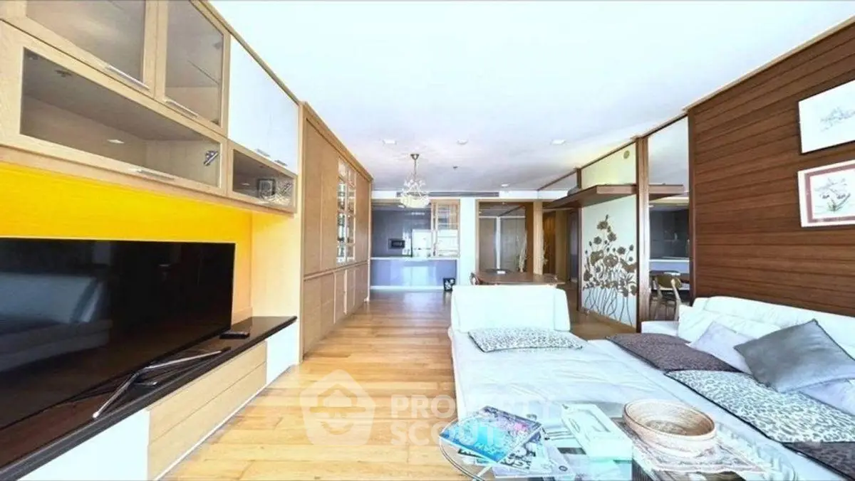 Spacious modern living room with elegant decor and large TV unit