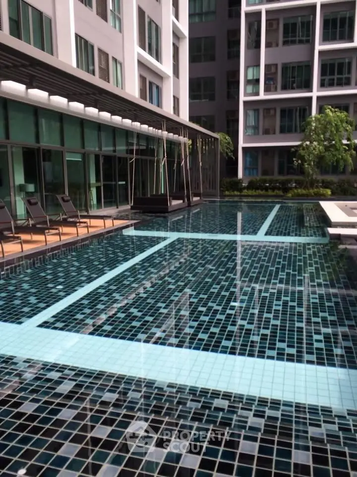 Luxurious modern apartment complex with stunning outdoor pool area and sleek design.