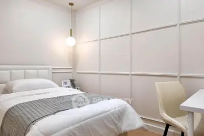 Cozy minimalist bedroom with modern decor and soft lighting