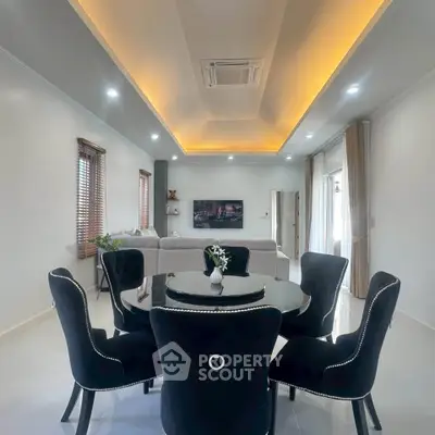 Elegant living room with modern furniture and ambient lighting, perfect for stylish entertaining.