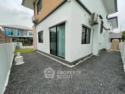 Modern corner unit exterior with sleek design and air conditioning units