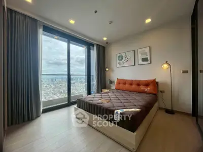 Modern bedroom with stunning city view from large window