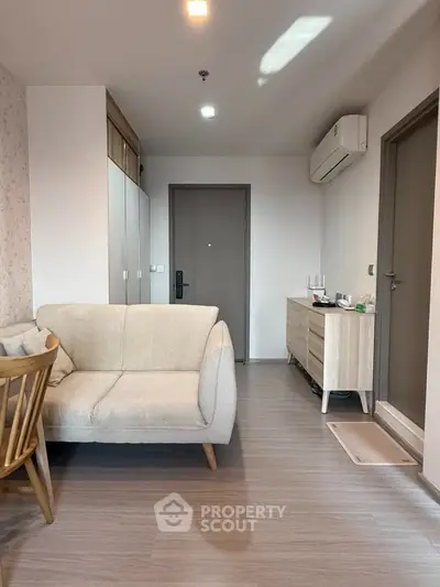 Modern living room with stylish furniture and air conditioning in a cozy apartment.