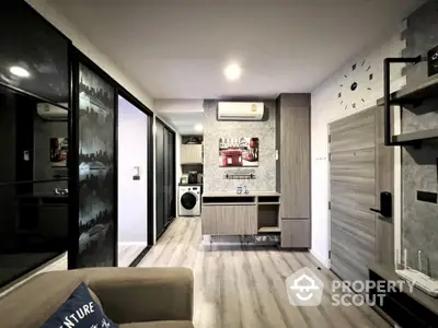 Modern living room with stylish decor and in-unit washing machine