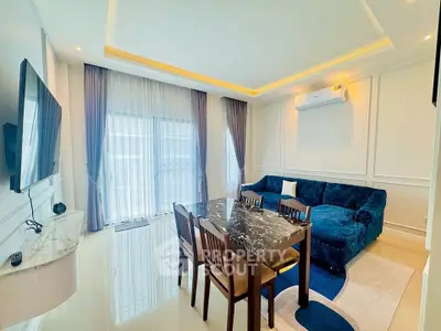 Elegant living room with modern furniture and large windows for natural light