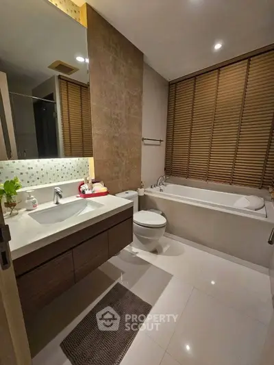 Luxurious bathroom with modern fixtures and elegant bathtub in a stylish home.