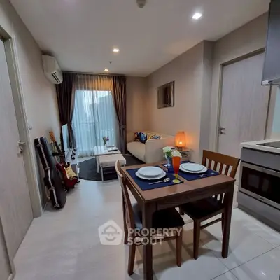 Modern living room with dining area and musical instruments, perfect for urban living.