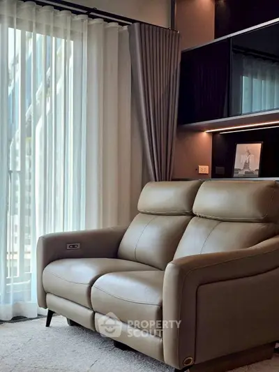 Luxurious living room with elegant leather sofa and floor-to-ceiling curtains