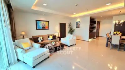 Spacious modern living room with elegant decor and dining area, perfect for entertaining.