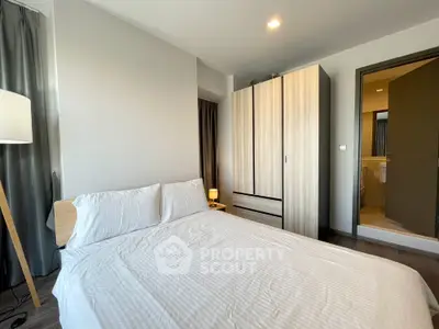 Modern bedroom with stylish wardrobe and cozy lighting