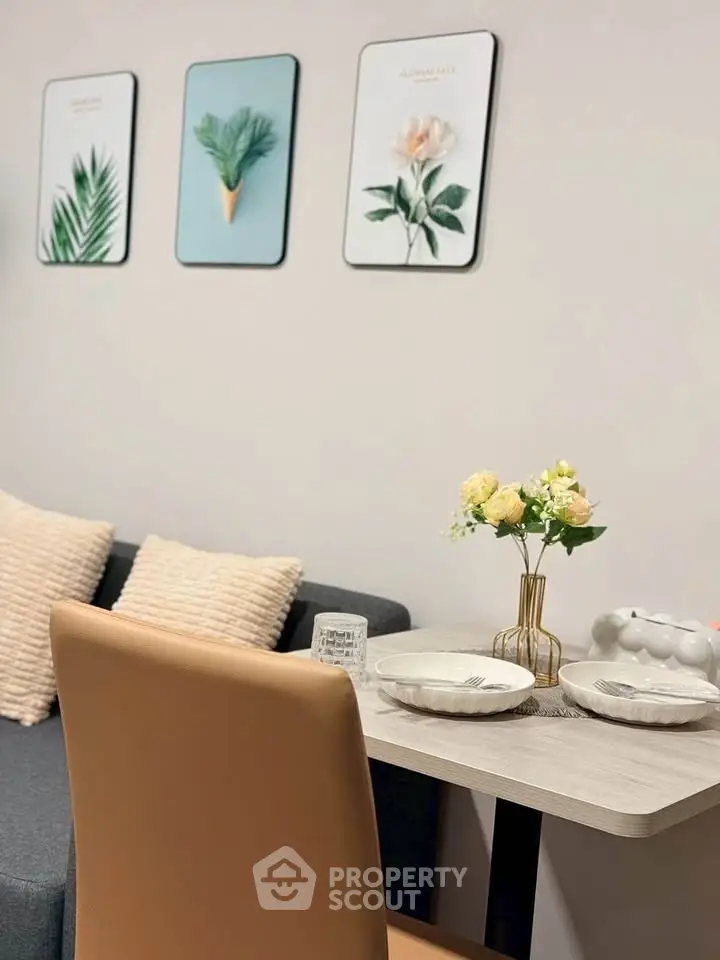 Stylish dining area with modern decor and cozy seating in a contemporary apartment.