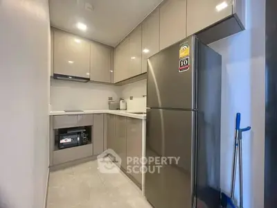 Modern kitchen with sleek cabinets and stainless steel appliances