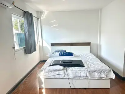 Bright and airy bedroom with modern furnishings and natural light.