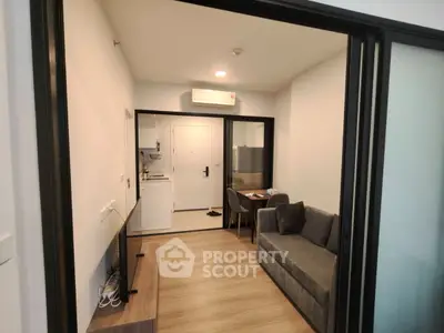 Modern apartment interior with cozy living room and compact kitchen