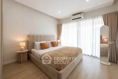 Elegant bedroom with modern decor and natural light
