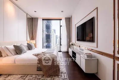 Luxurious modern bedroom with city view, elegant decor, and large wall-mounted TV.
