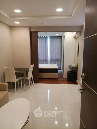 Modern studio apartment with sleek furniture and natural light