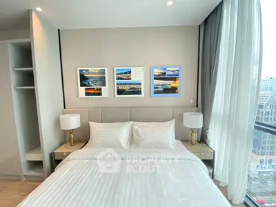 Modern bedroom with city view, elegant decor, and natural light