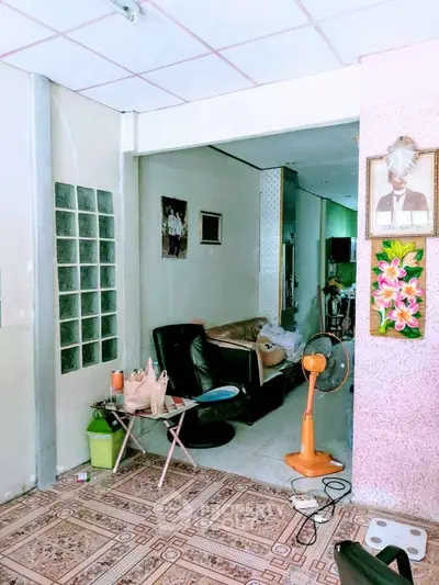 Cozy living room with eclectic decor and comfortable seating area.