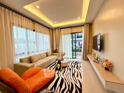 Modern living room with stylish decor and large windows for natural light