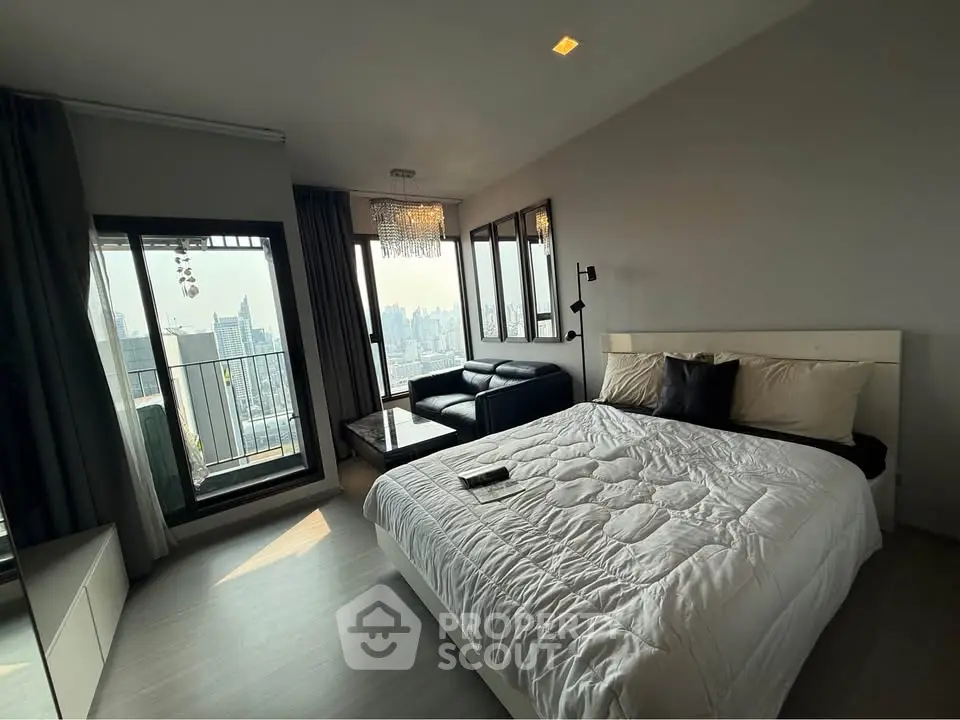 Luxurious bedroom with city view and balcony access in modern apartment