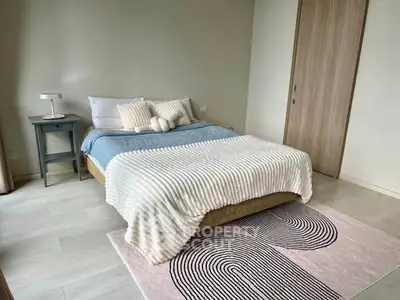 Cozy modern bedroom with stylish decor and natural light