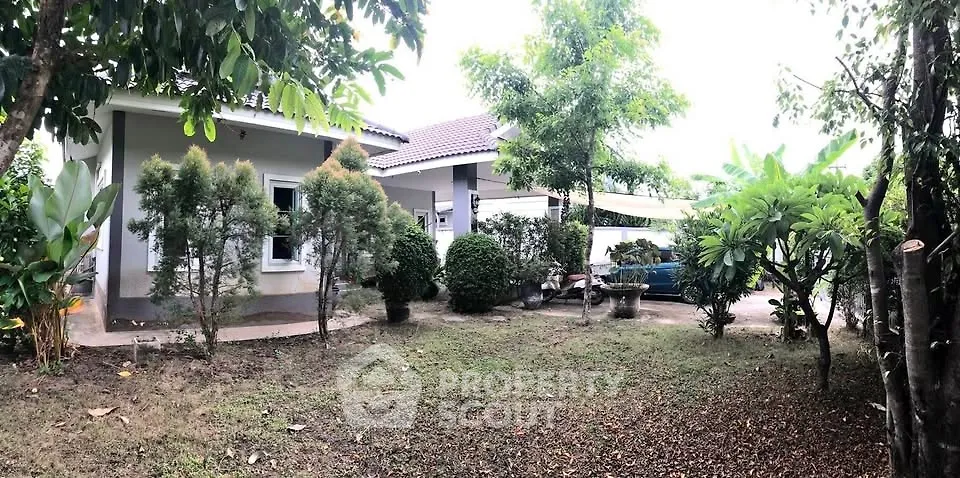 Charming suburban home with lush garden and spacious yard, perfect for family living.