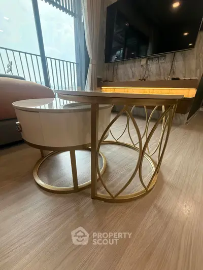 Modern living room with stylish furniture and balcony view