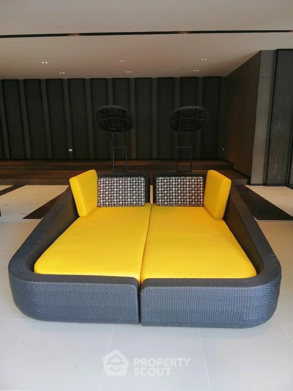 Modern lounge area with stylish yellow seating and sleek design
