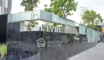 Modern building entrance with sleek glass and marble design