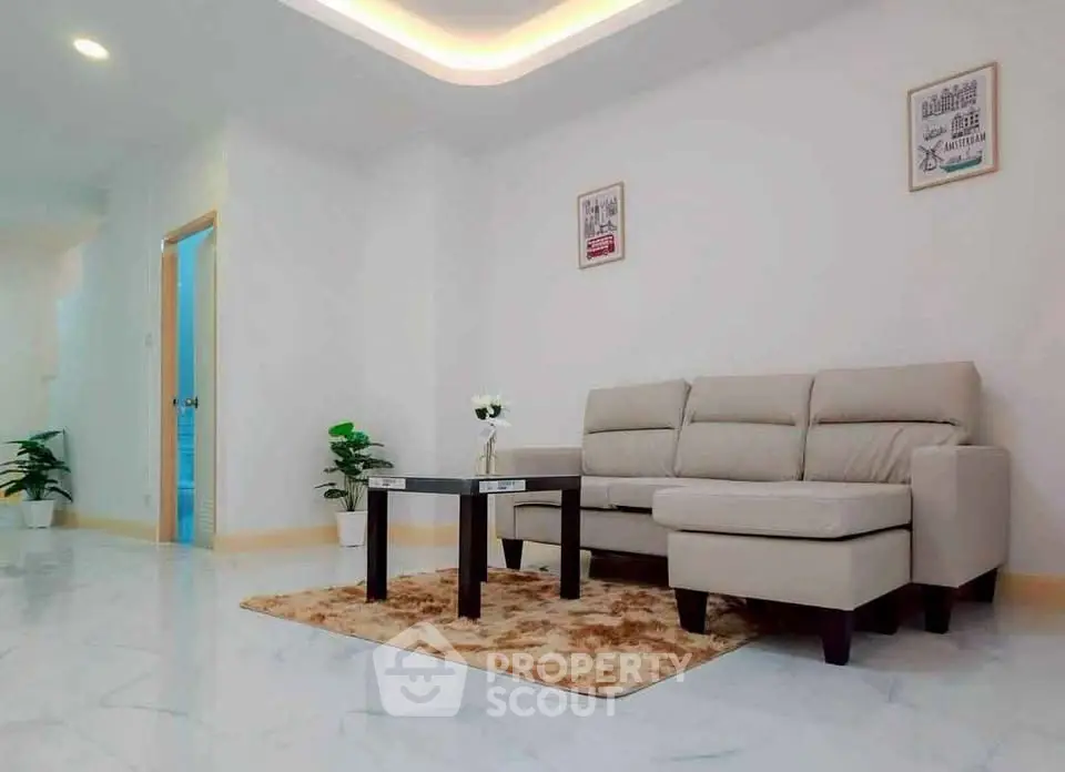 Spacious modern living room with elegant sofa and stylish decor