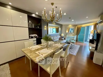 Luxurious open-plan living room with elegant dining area and modern decor.