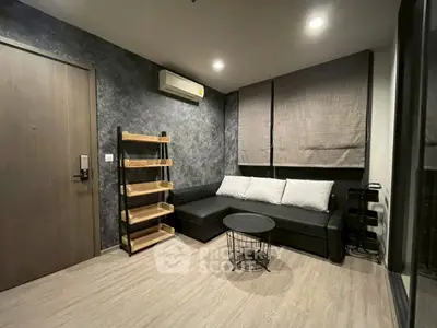 Modern living room with stylish decor and cozy seating area.