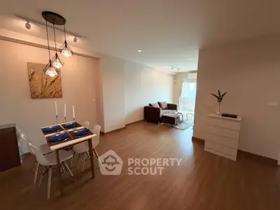 Spacious modern living room with elegant dining area and stylish decor.