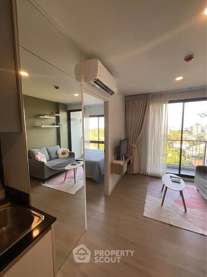Modern living room with balcony view in stylish apartment