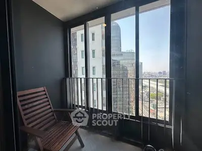 Modern balcony with city view, featuring sleek design and comfortable seating, perfect for relaxation.