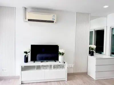 Modern living room with air conditioning and sleek white furniture