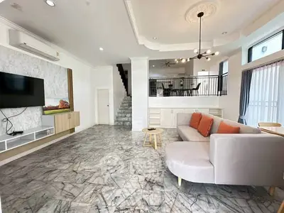 Spacious modern living room with marble flooring and stylish decor