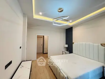 Luxurious modern bedroom with elegant lighting and stylish decor