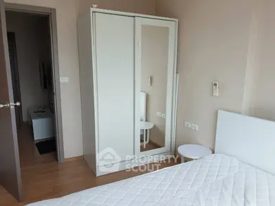 Modern bedroom with white wardrobe and minimalist decor