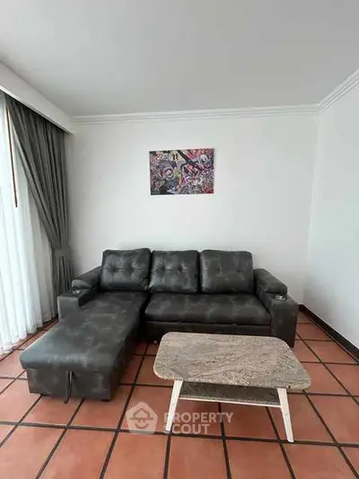 Stylish living room with modern sofa and chic coffee table, perfect for relaxation.